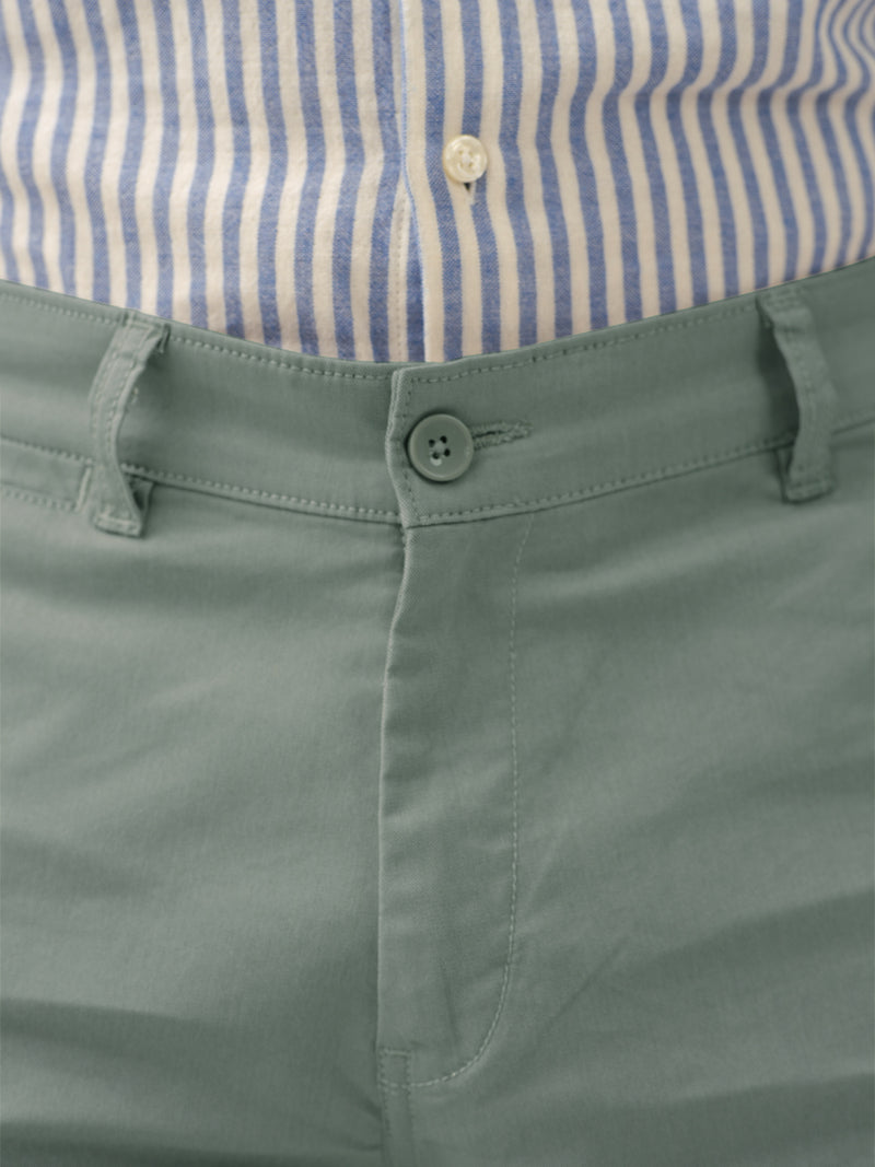 close up view of green chino pants by pant project with classic fit