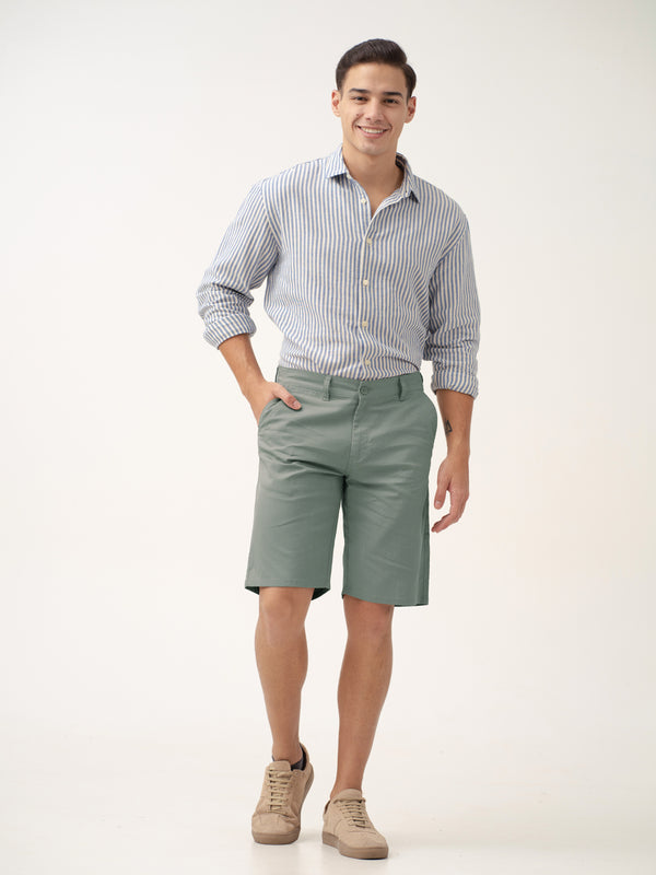 full view of green shorts by pant project with striped shirt