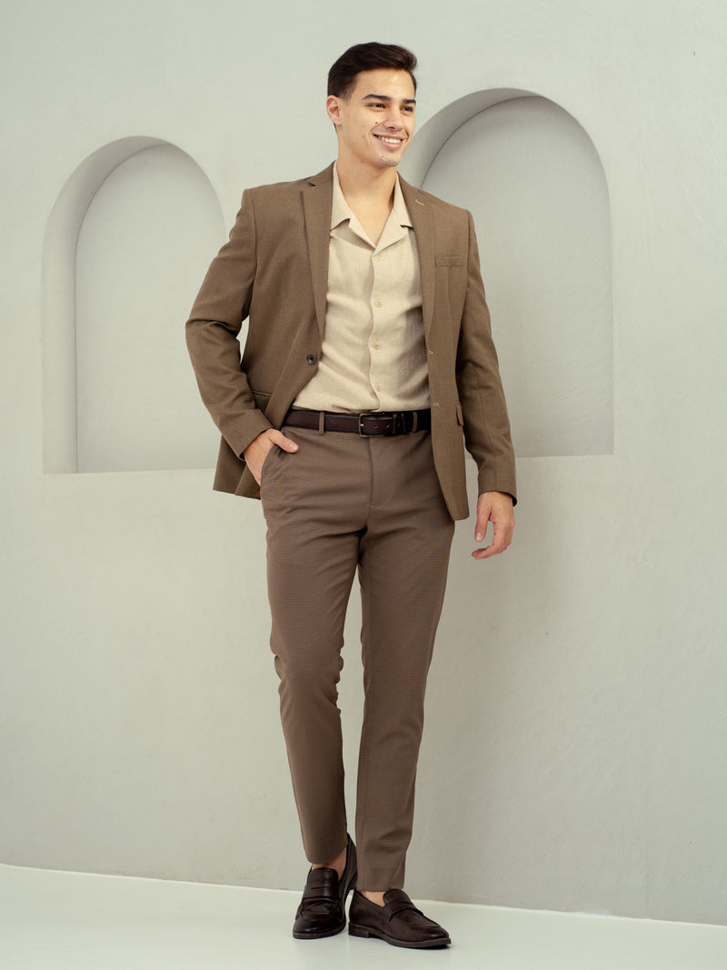 front view of man wearing umbre brown pants by pant project with blazer