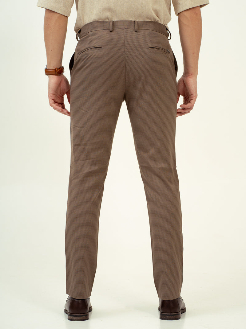 rear view of umbre brown pant by pant project showcasing tailored fit