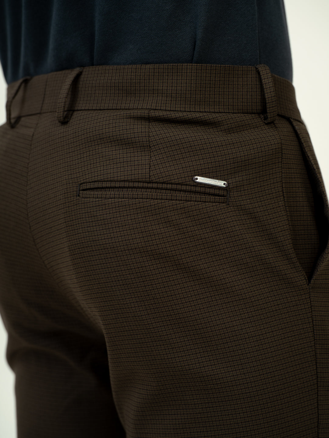 close-up side view of harvest green checks pant by pant project adjustable waist