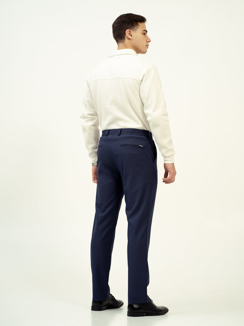 back view of navy pant by pant project showing tailored fit