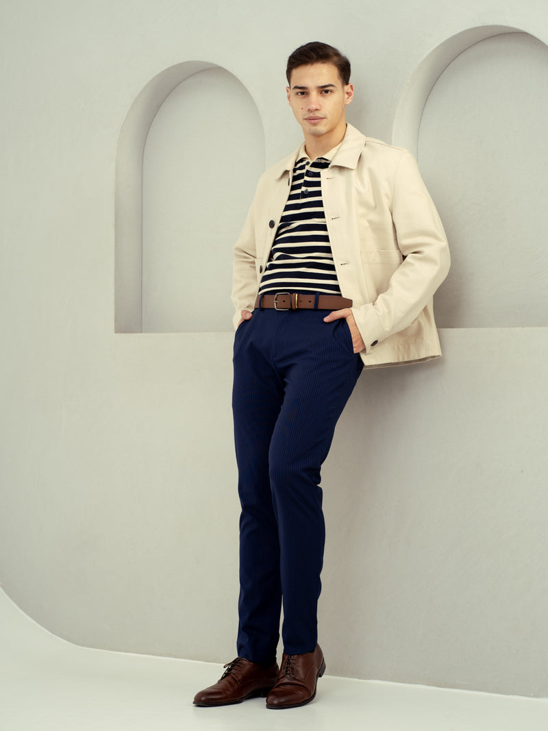 front view of navy pants by pant project with beige blazer ensemble