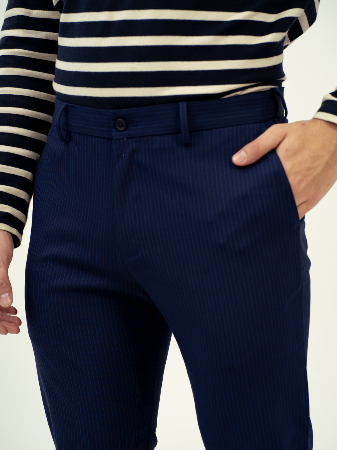 close-up front view of navy pinstripe pant by pant project elegant texture