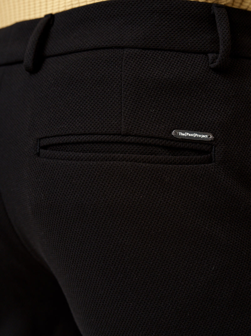 close side view of modern black texture pants front showcasing pocket details by the Pant Project