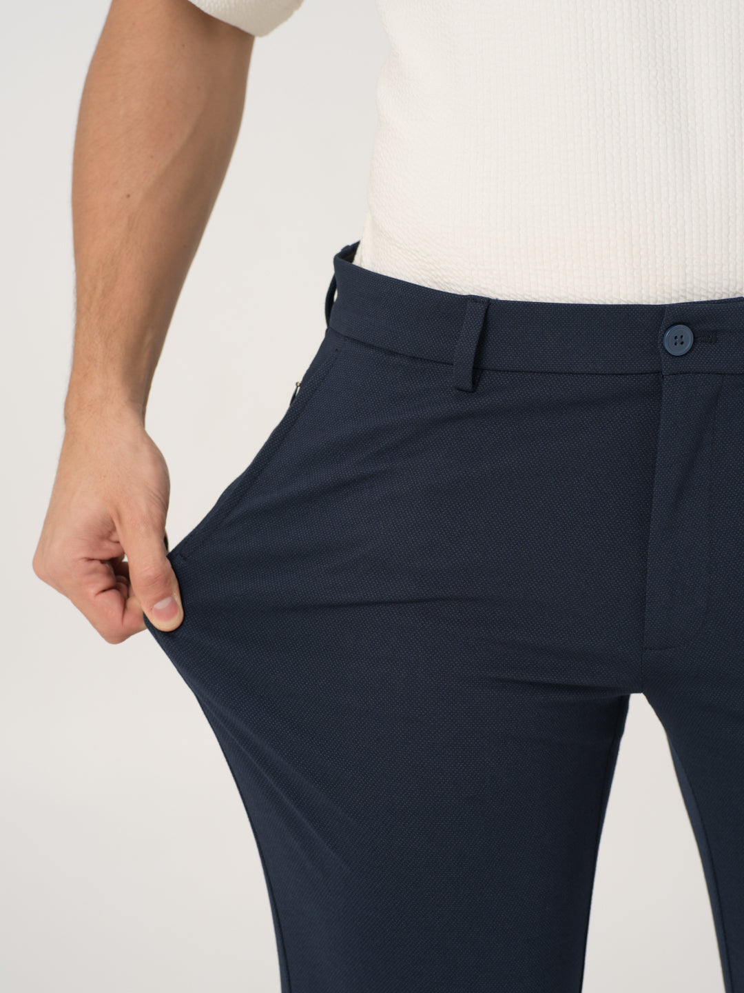 Close-up view of navy blue stretchable trousers by pant project focusing on the stretchable waistband