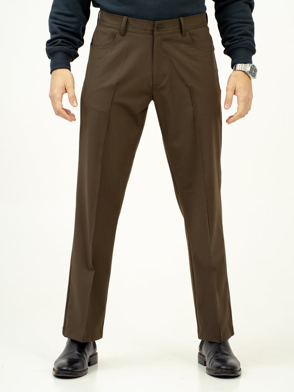 front view of green pintuck pants by pant project with classic fit