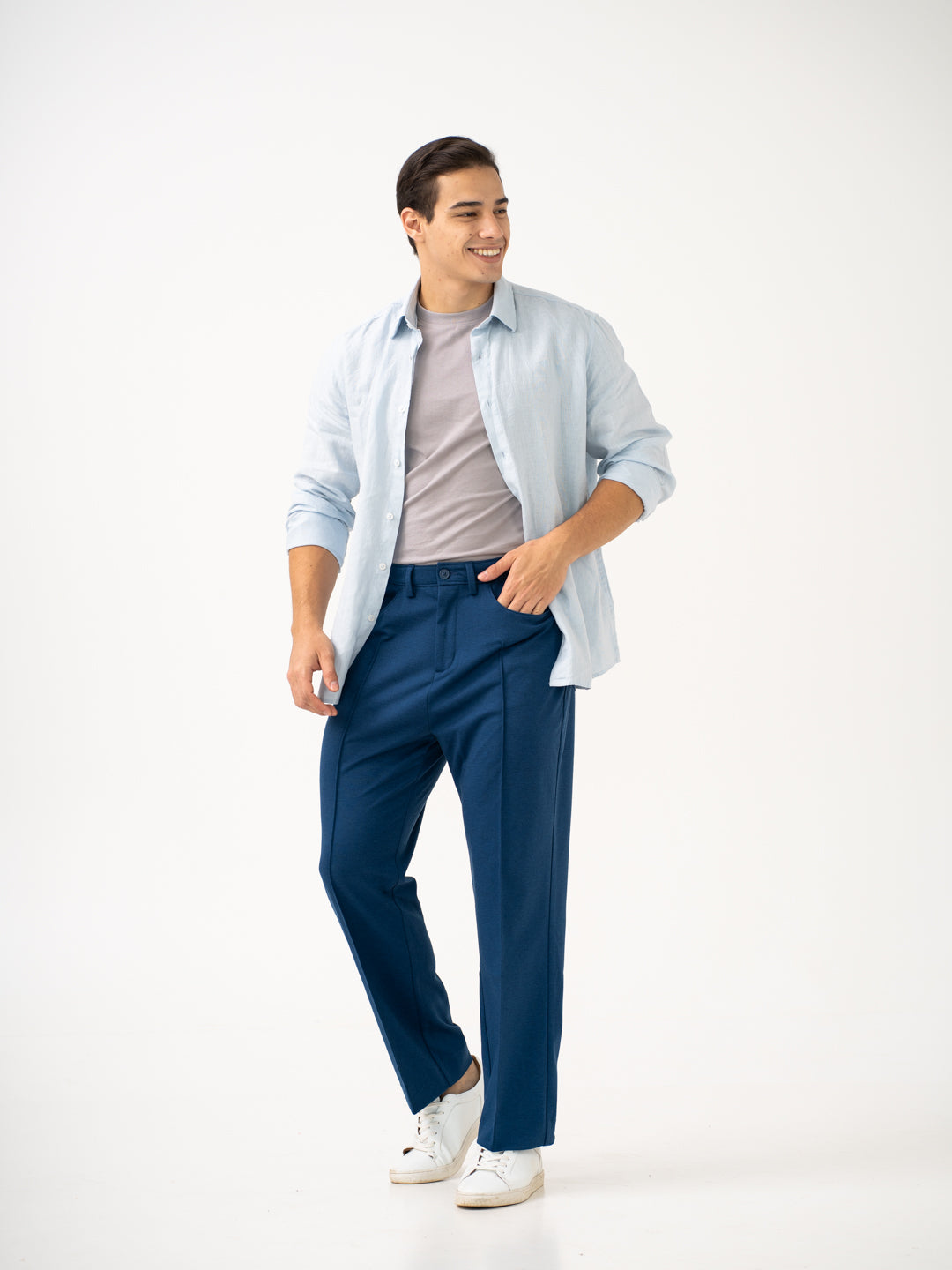Front view of blue pintuck pants by pant project, focusing on the relaxed fit and design