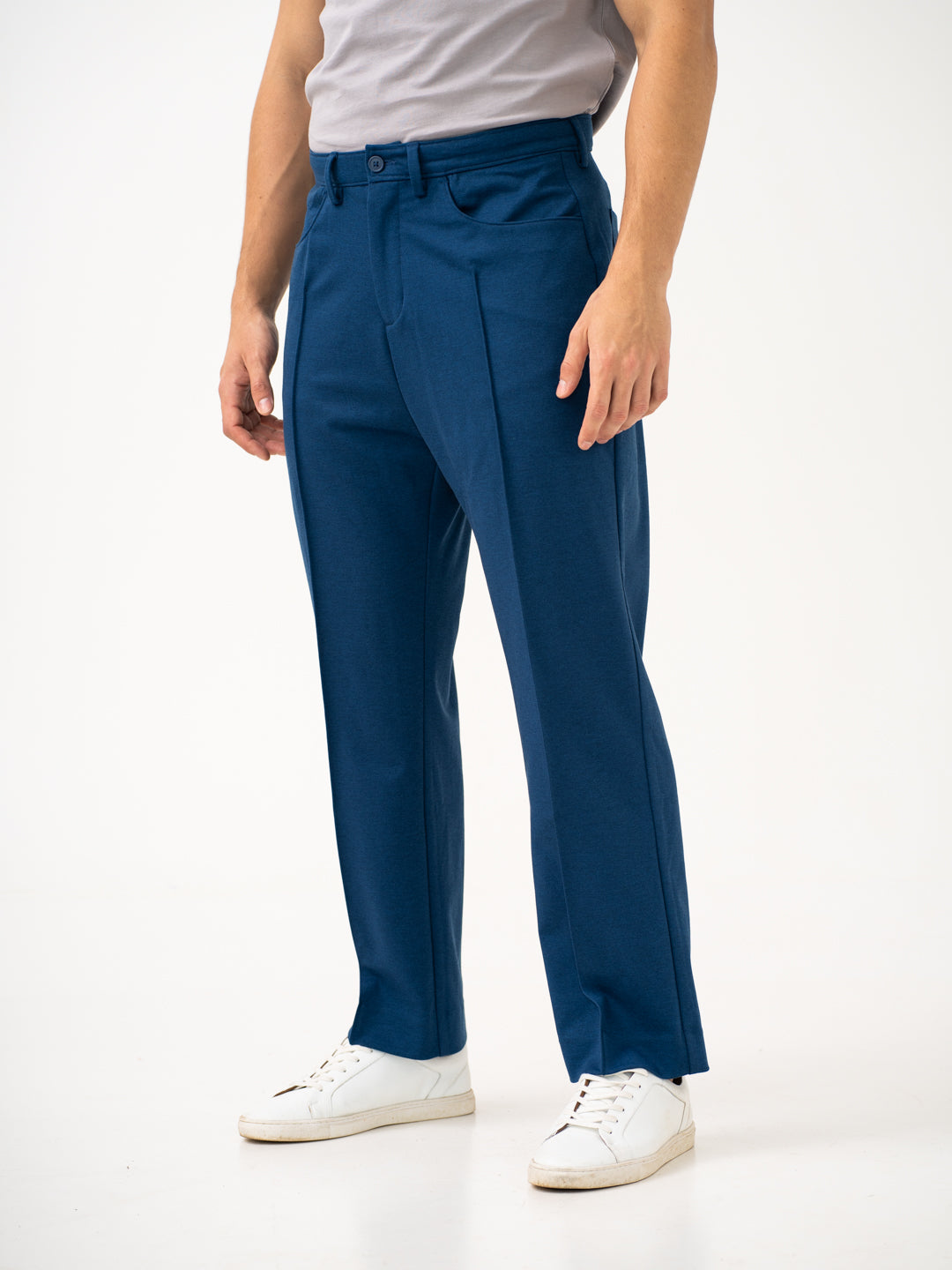 Full view of blue pintuck pants by pant project, focusing on the relaxed fit and straight leg design