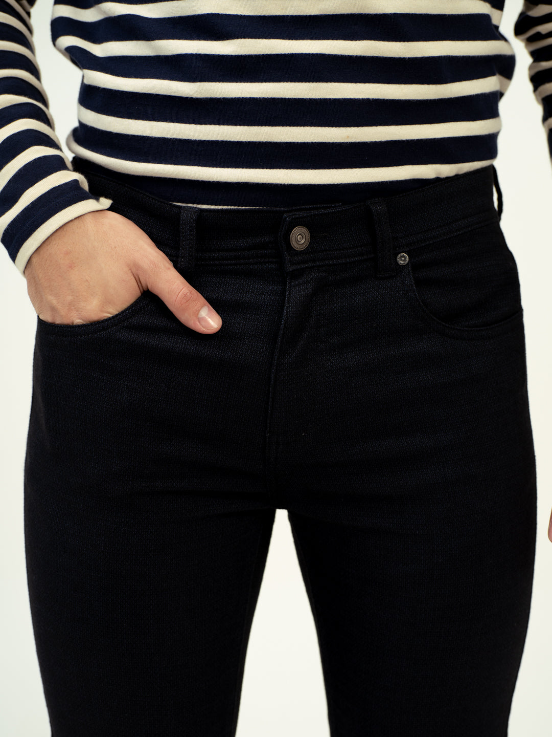 front view of black jeans by pant project with classic fit