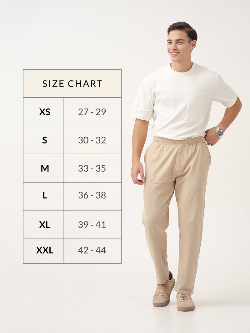 front view of nomad beige sweatpant by pant project with size chart displayed