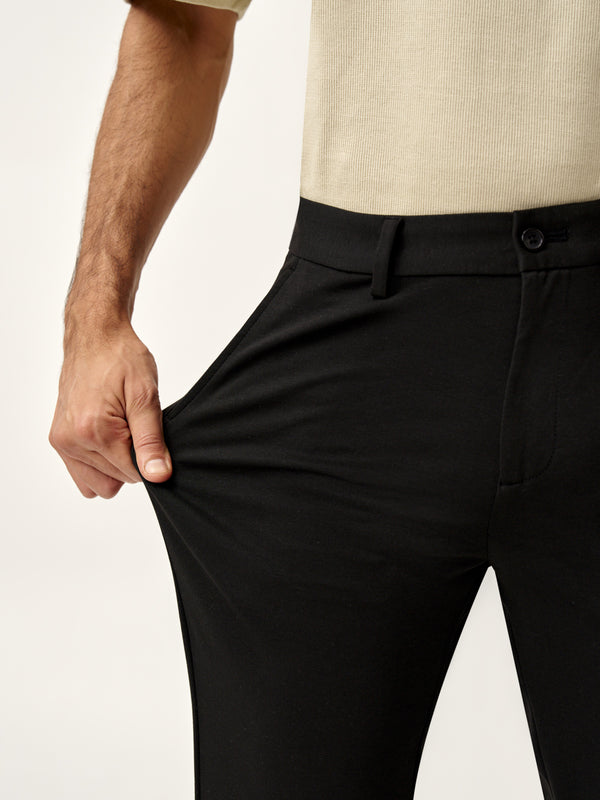 Stretch demonstration of bangalore black pants from the Pant Project, showcasing flexibility