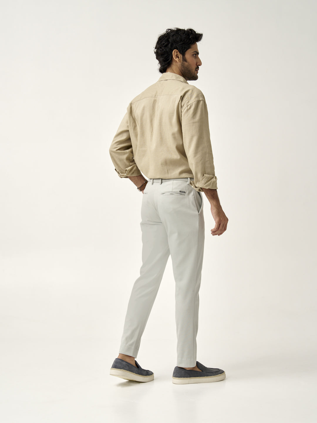 back full view of man wearing matcha green pants of the Pant Project 