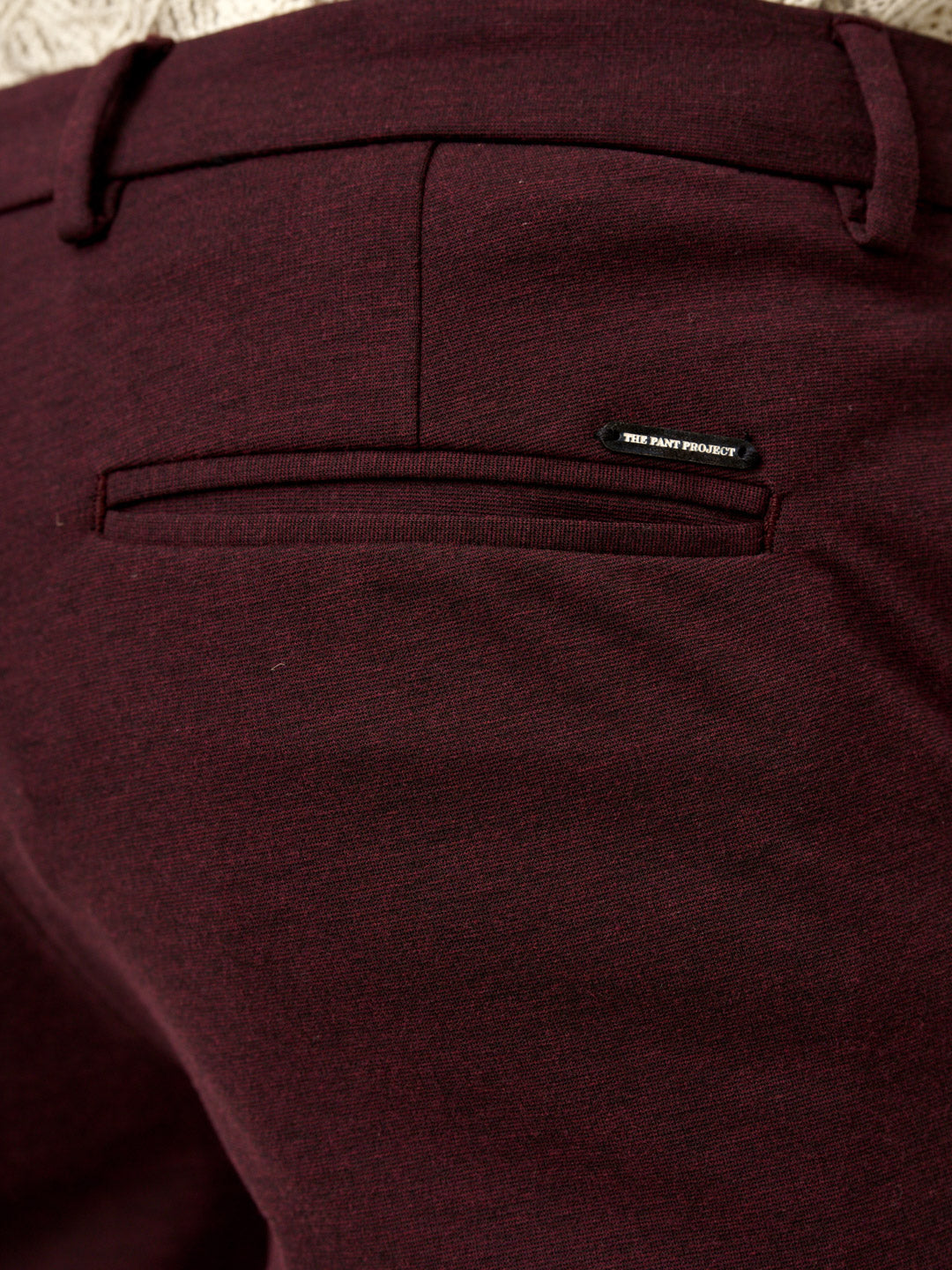 back pocket and logo detail of plum wine trousers, the Pant Project
