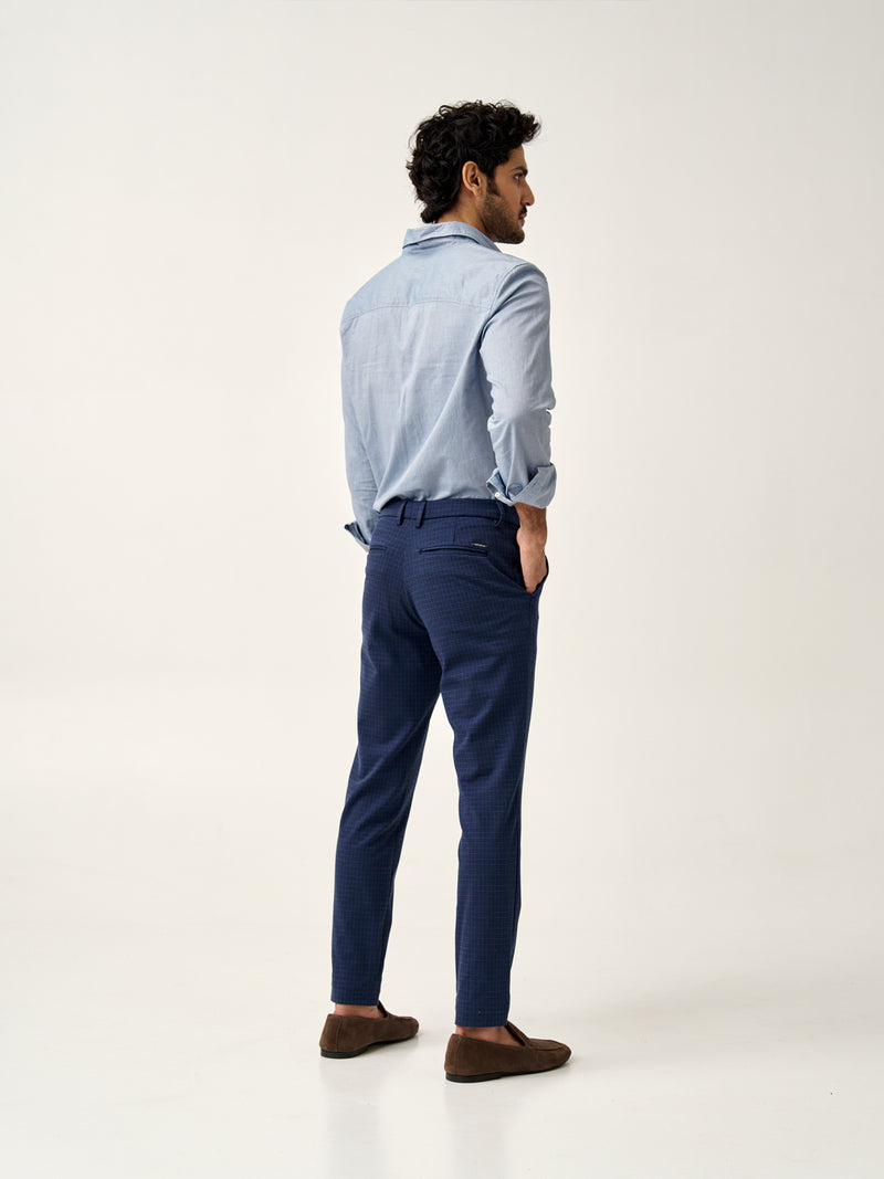 back pocket detail of blue check pants from the Pant Project featuring logo tag