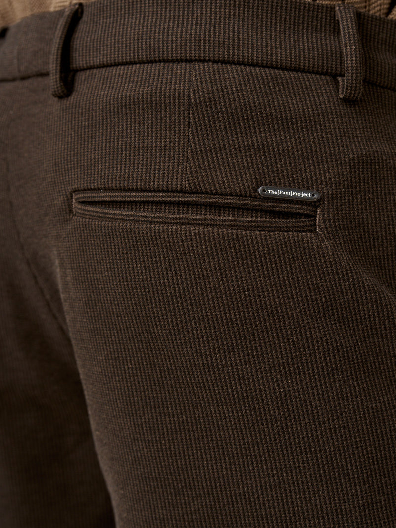 back pocket detail of the walnut brown pants with logo badge from the Pant Project