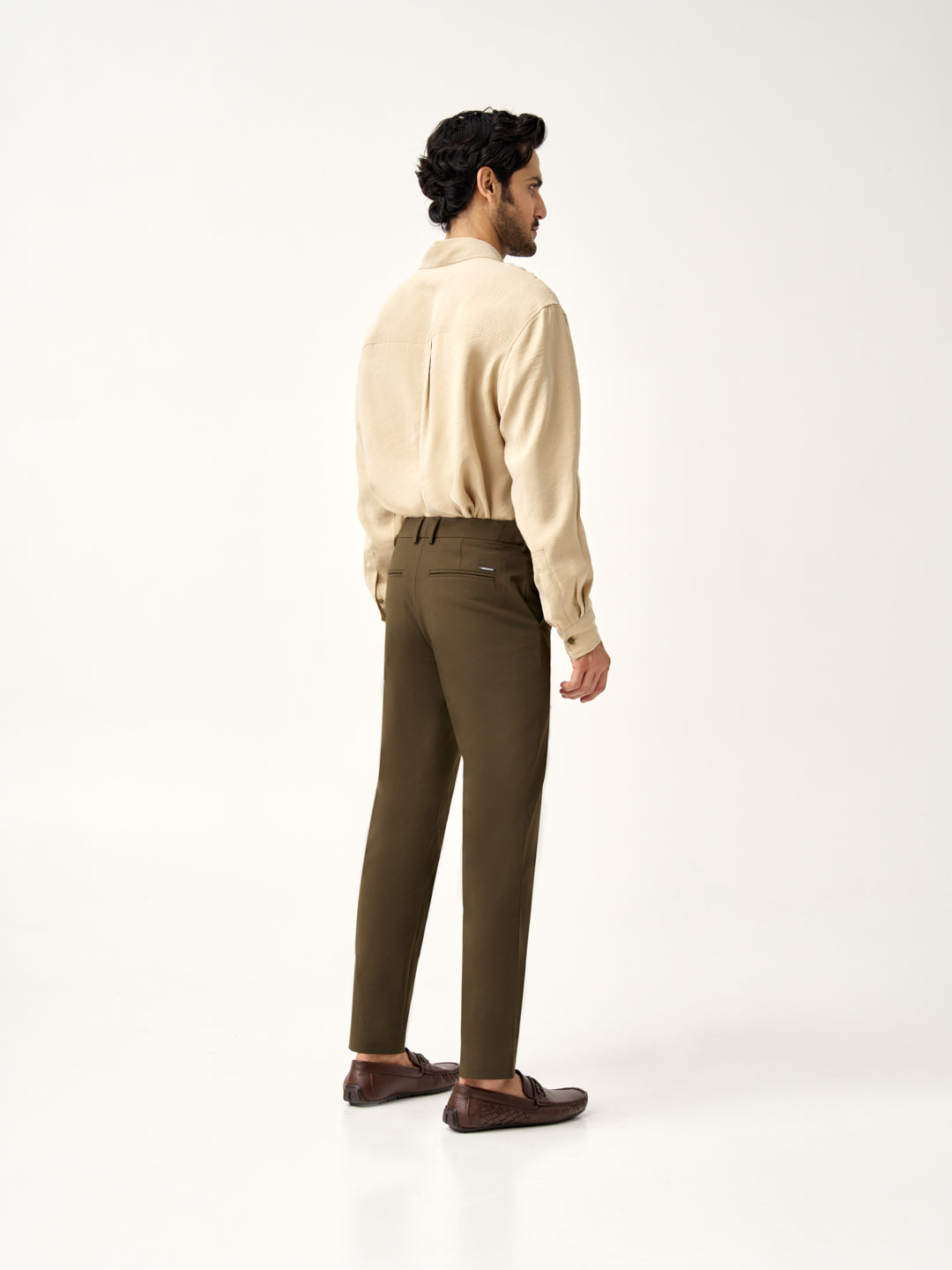  back view of Pant Project olive green stretchable pants