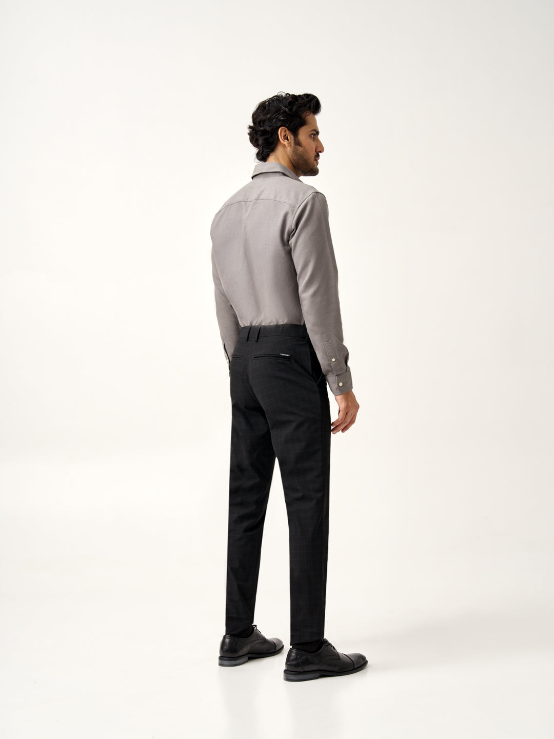 back view of Pant Project raven black stretchable trousers