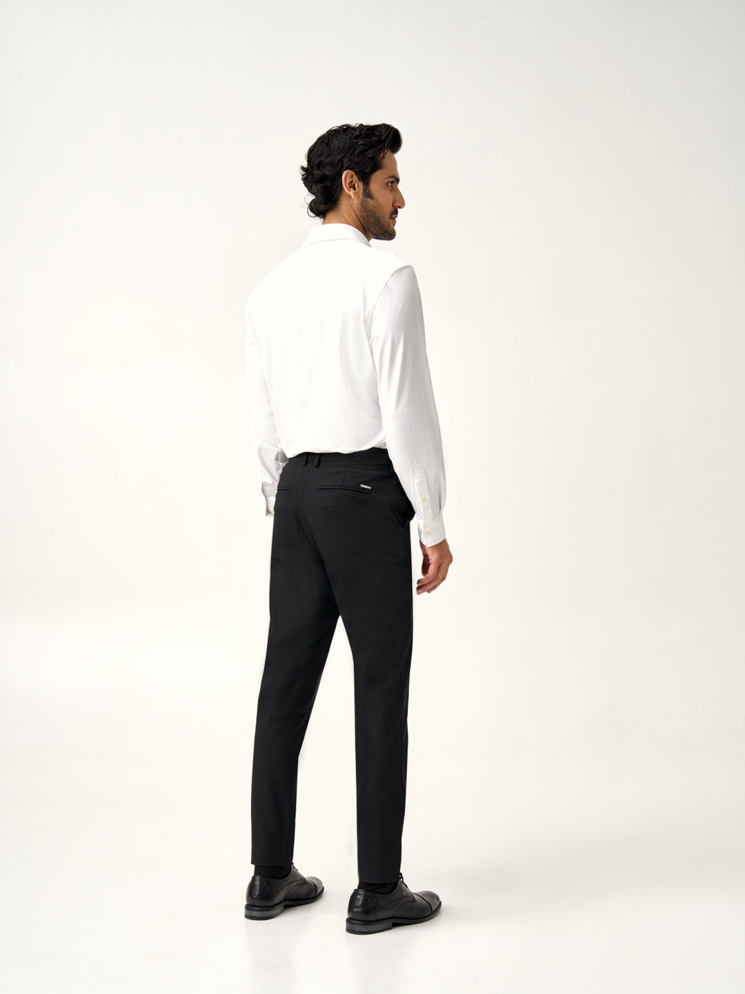 back view of Pant Project's ebony black stretchable trousers