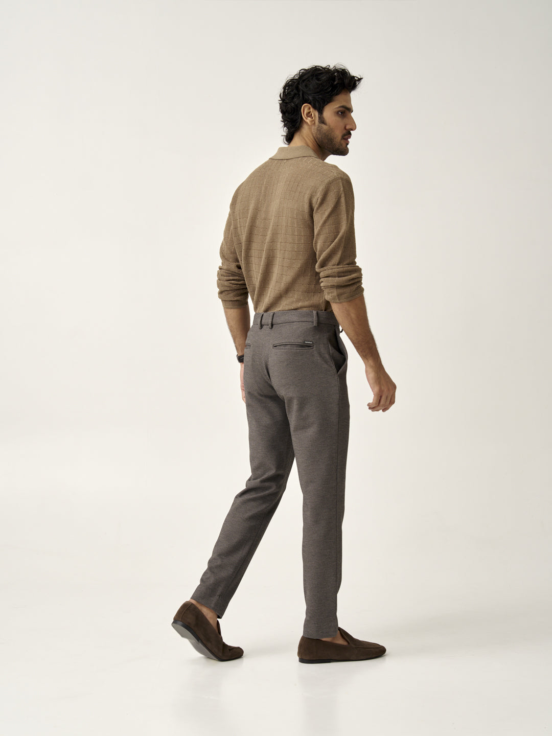 back view of a man wearing granite texture pants from the Pant Project