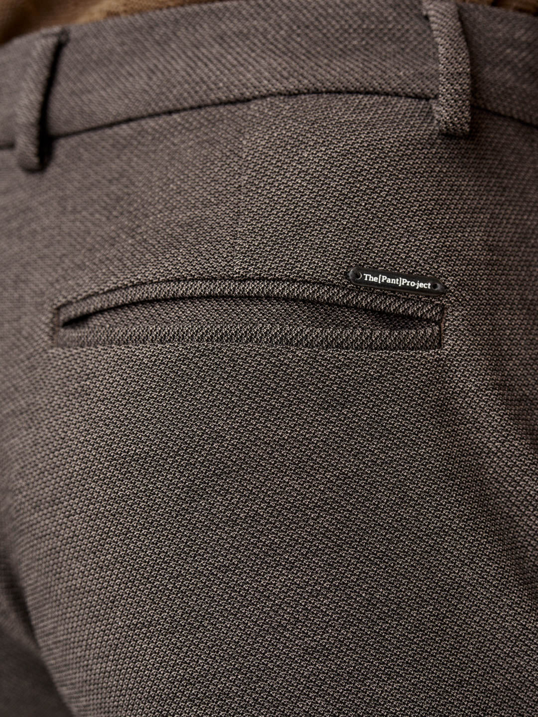 close-up of back pocket showing detailed granite texture pants from the Pant Project