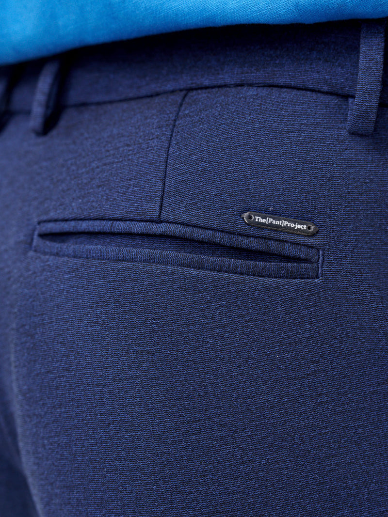 close view of back pocket and logo detail on insignia blue pants by the Pant Project