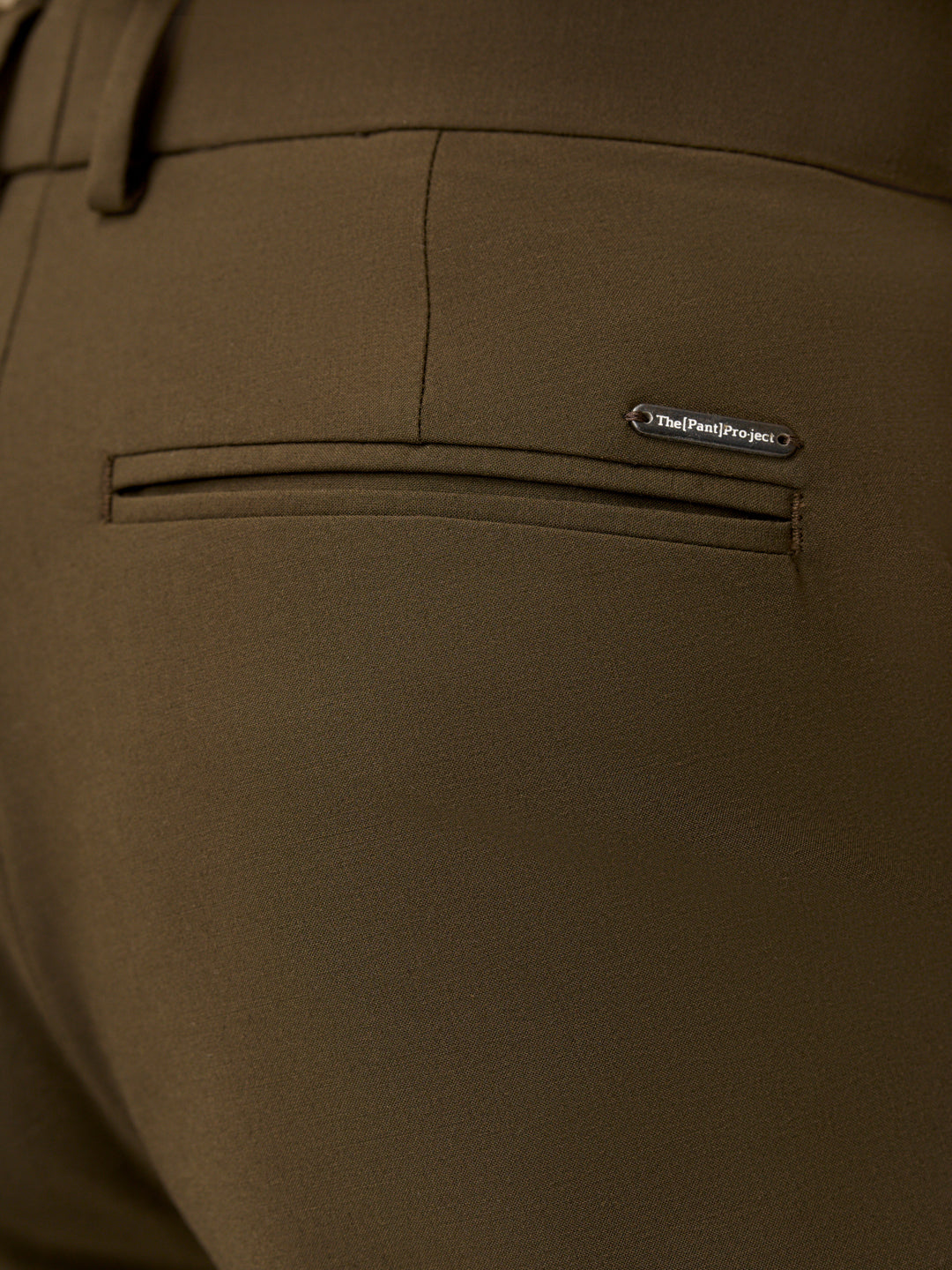 close view of back pocket design on Pant Project olive green stretchable pants