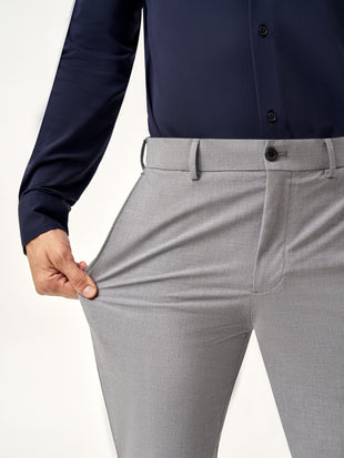 close view of model wearing Pant Project mineral grey stretchable pants