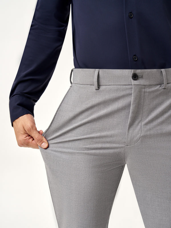 close view of model wearing Pant Project mineral grey stretchable pants