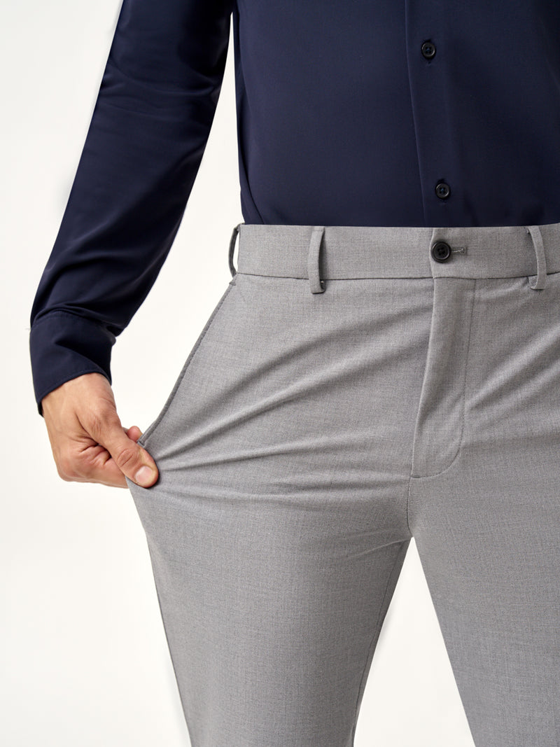 close view of model wearing Pant Project mineral grey stretchable pants