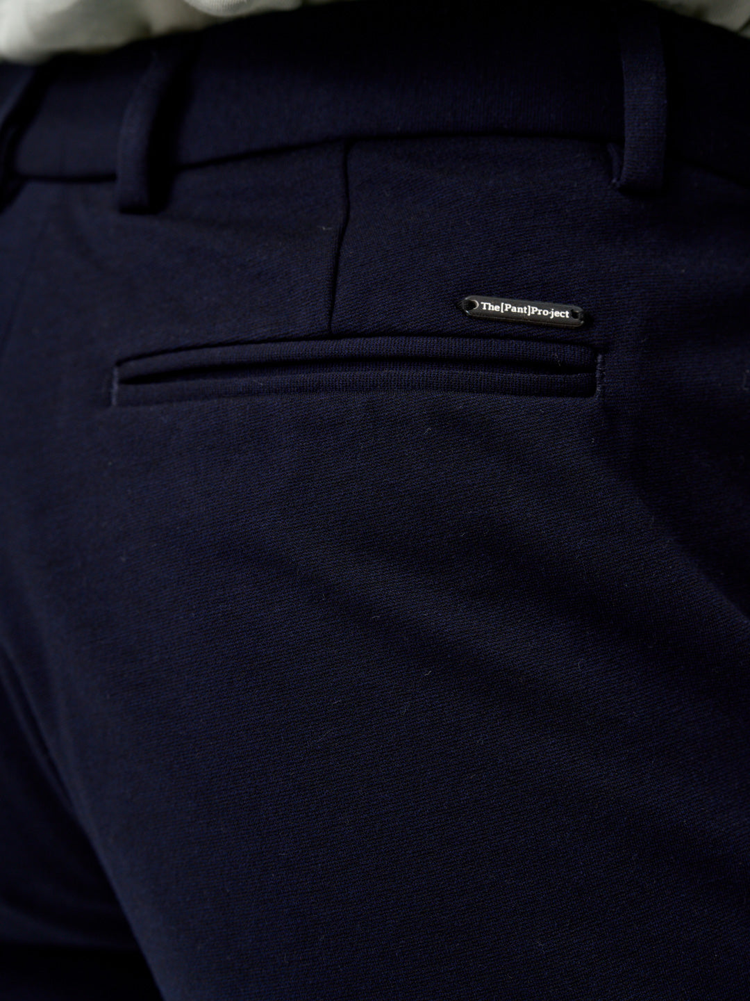 close view of the back pocket and stitching detail on the blue check pants by the Pant Project