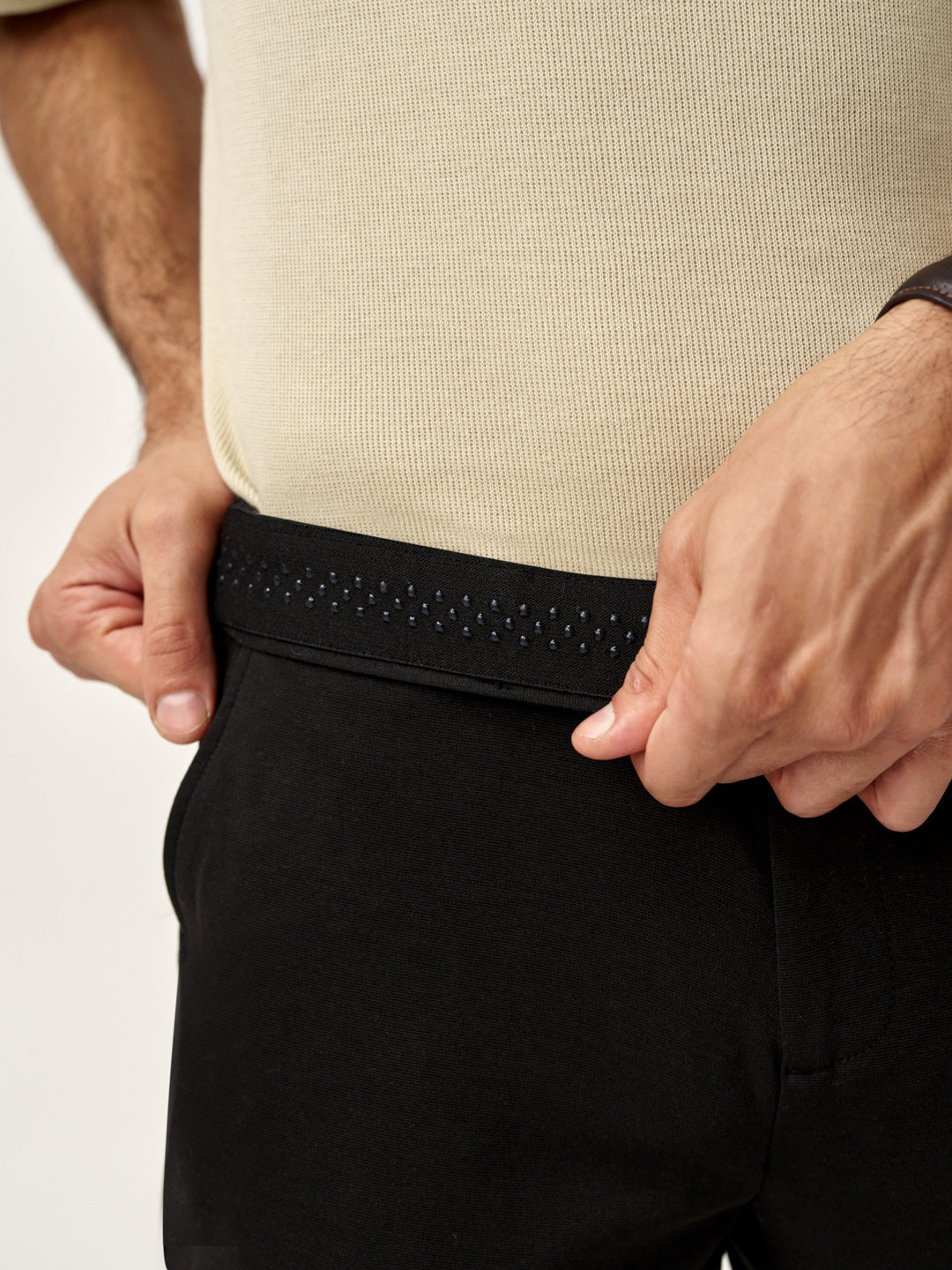 close view of waist grip detailing on bangalore black pants from the Pant Project