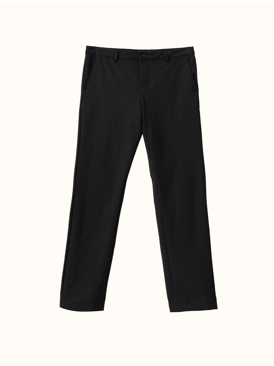 adjusting the stretchable waistband of modern black texture pants from the Pant Project