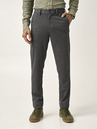front view of grey check pants worn with a green shirt, from the Pant Project