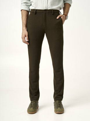 front view of olive green textured pants with button closure, from the Pant Project