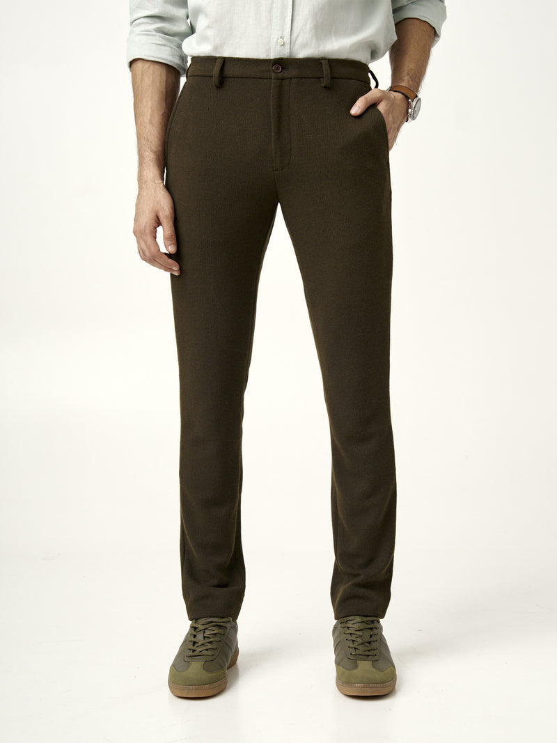 front view of olive green textured pants with button closure, from the Pant Project