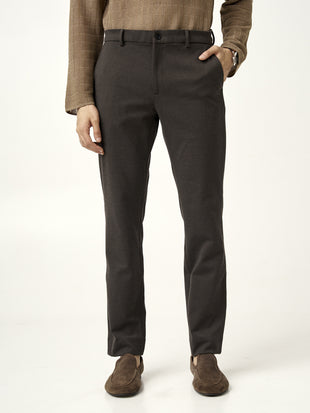 front view of walnut brown pants from the Pant Project, hands in pockets