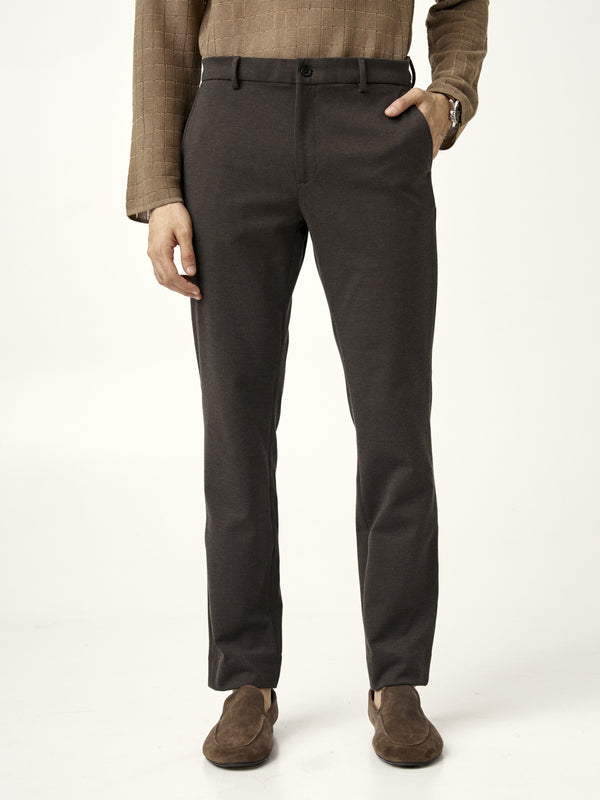 front view of walnut brown pants from the Pant Project, hands in pockets