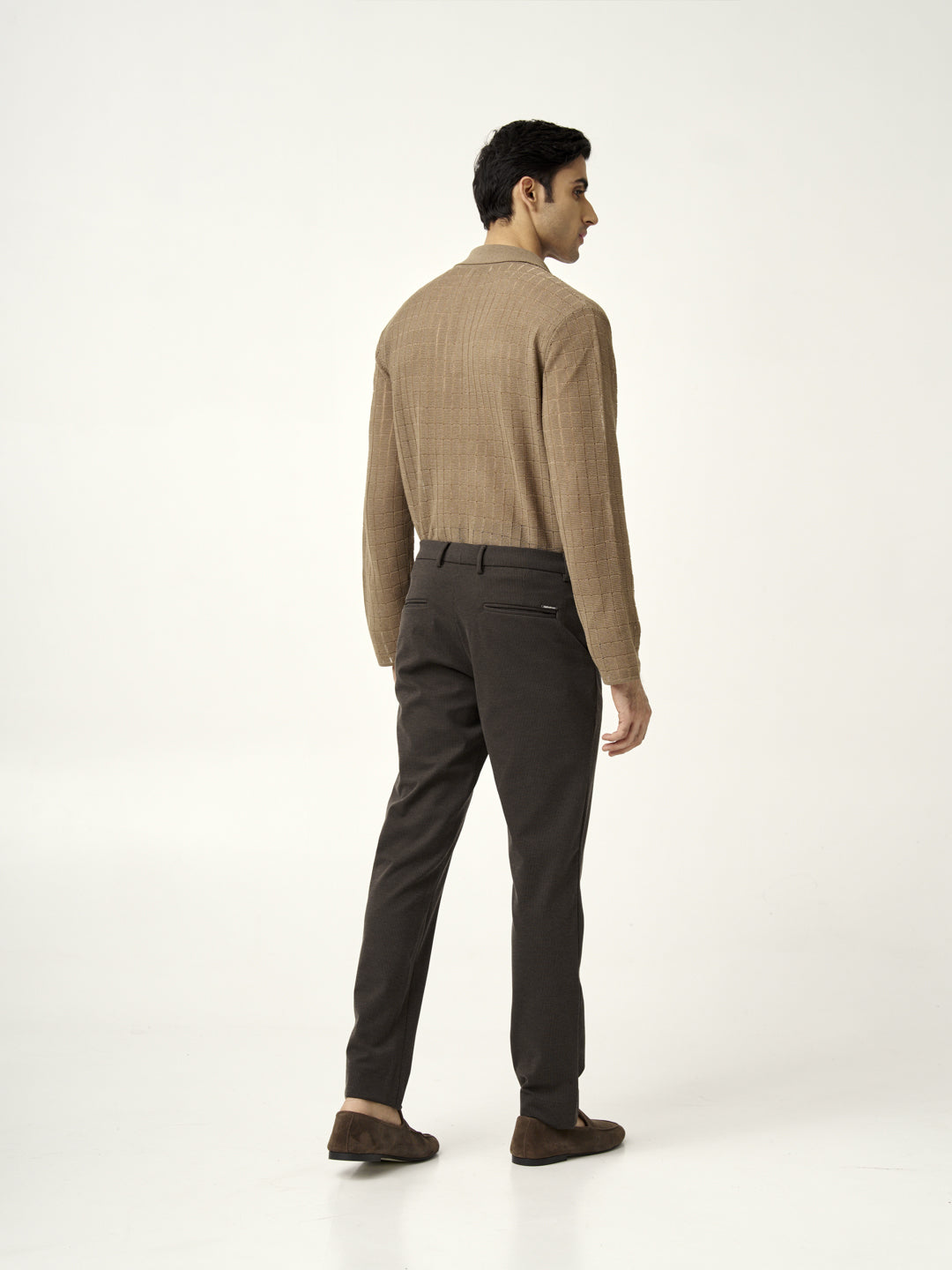 full back view of a model wearing walnut brown pants from the Pant Project