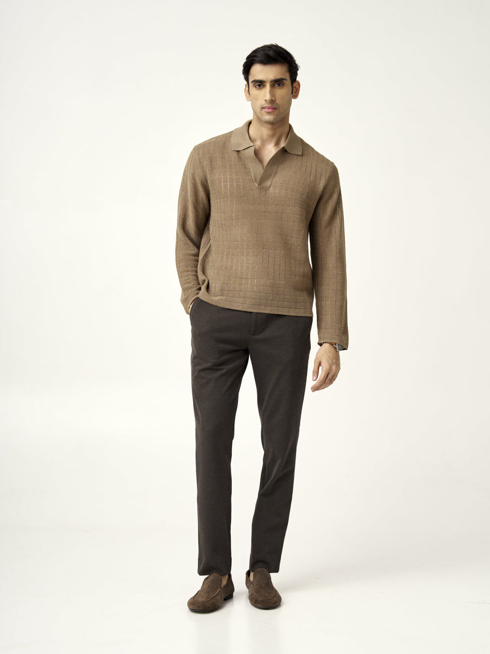 full front view of a model in walnut brown pants paired with a light brown sweater from the Pant Project