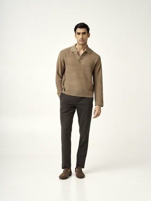 full front view of a model in walnut brown pants paired with a light brown sweater from the Pant Project
