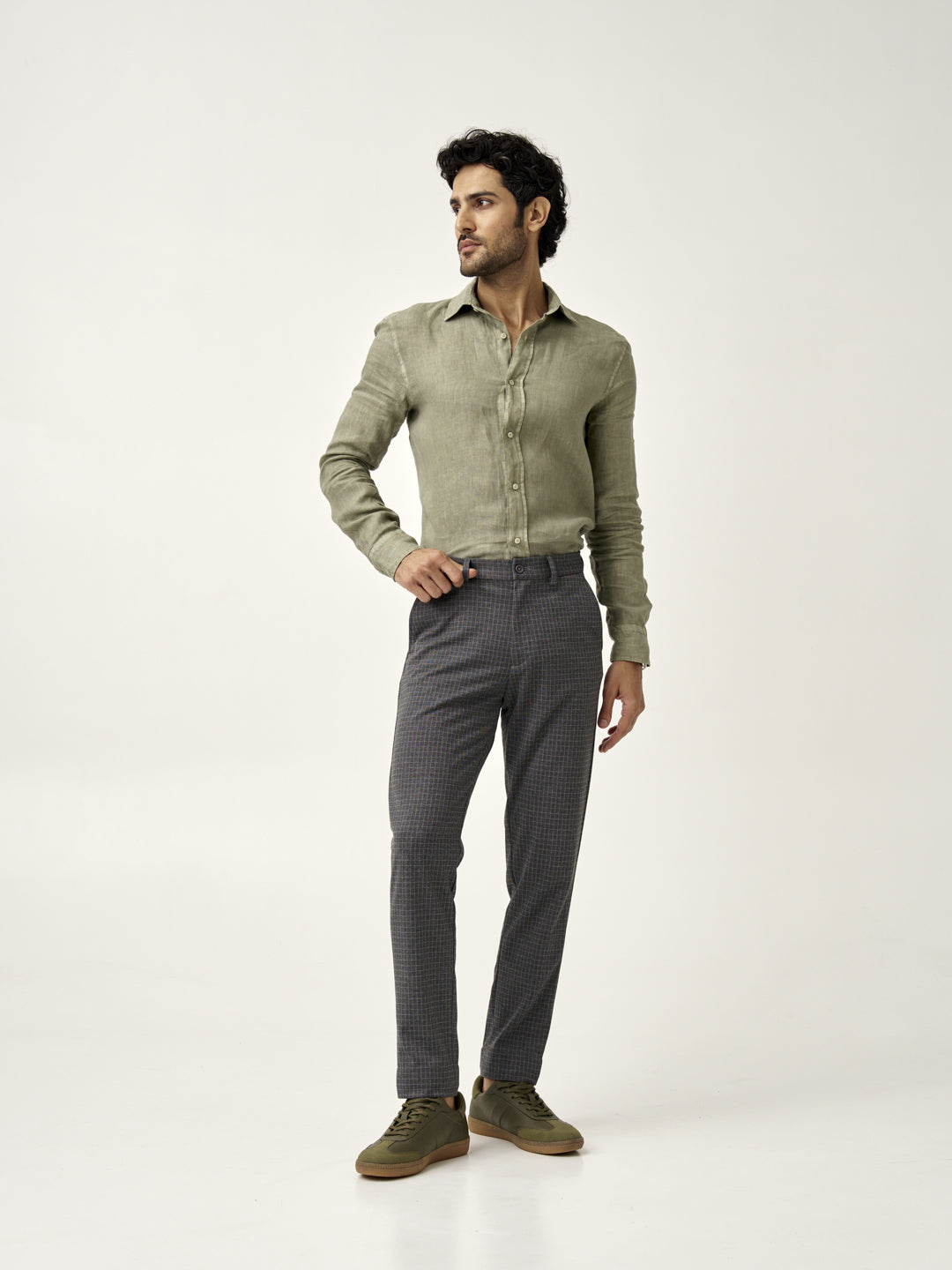 man standing in grey check pants and a green shirt from the Pant Project