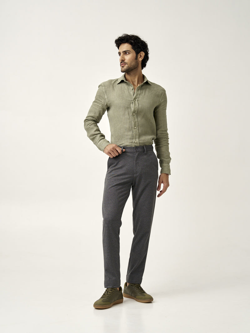 man standing in grey check pants and a green shirt from the Pant Project