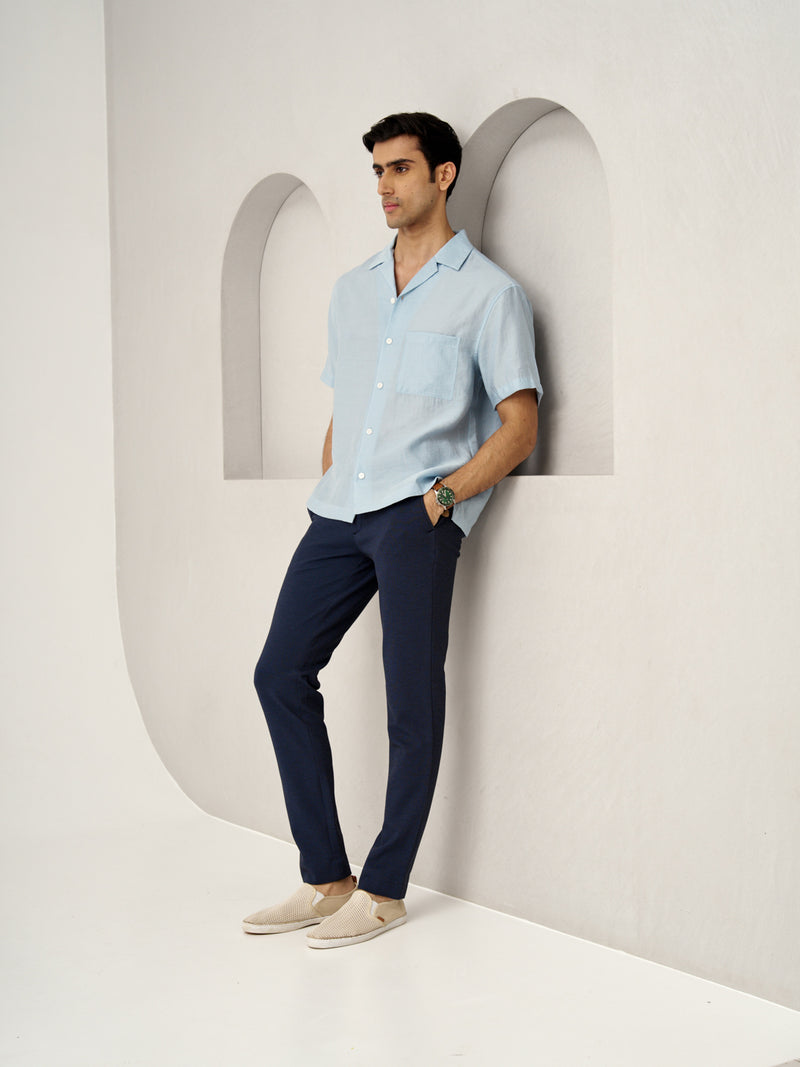 man wearing sail blue custom pants from the Pant Project paired with a light blue shirt