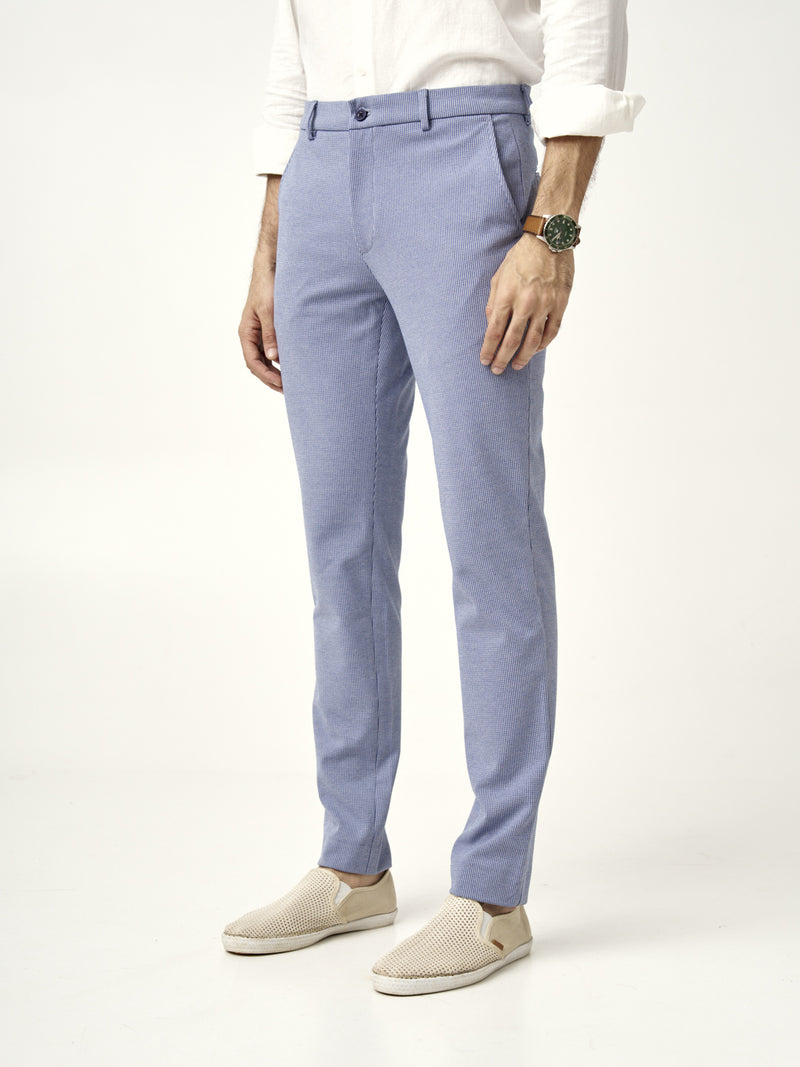 man wearing slim-fit scottish blue pants from the Pant Project with beige loafers