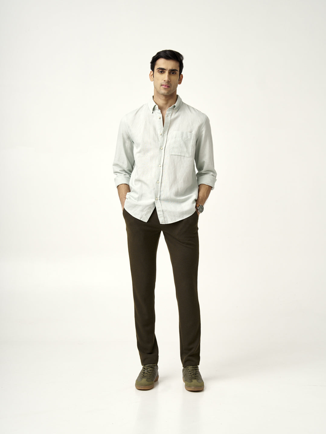 model in light green shirt with olive textured pants by the Pant Project