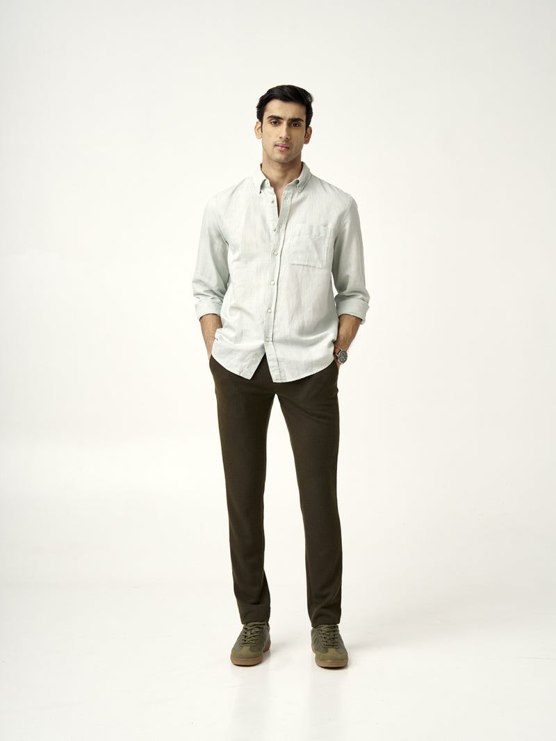 model in light green shirt with olive textured pants by the Pant Project