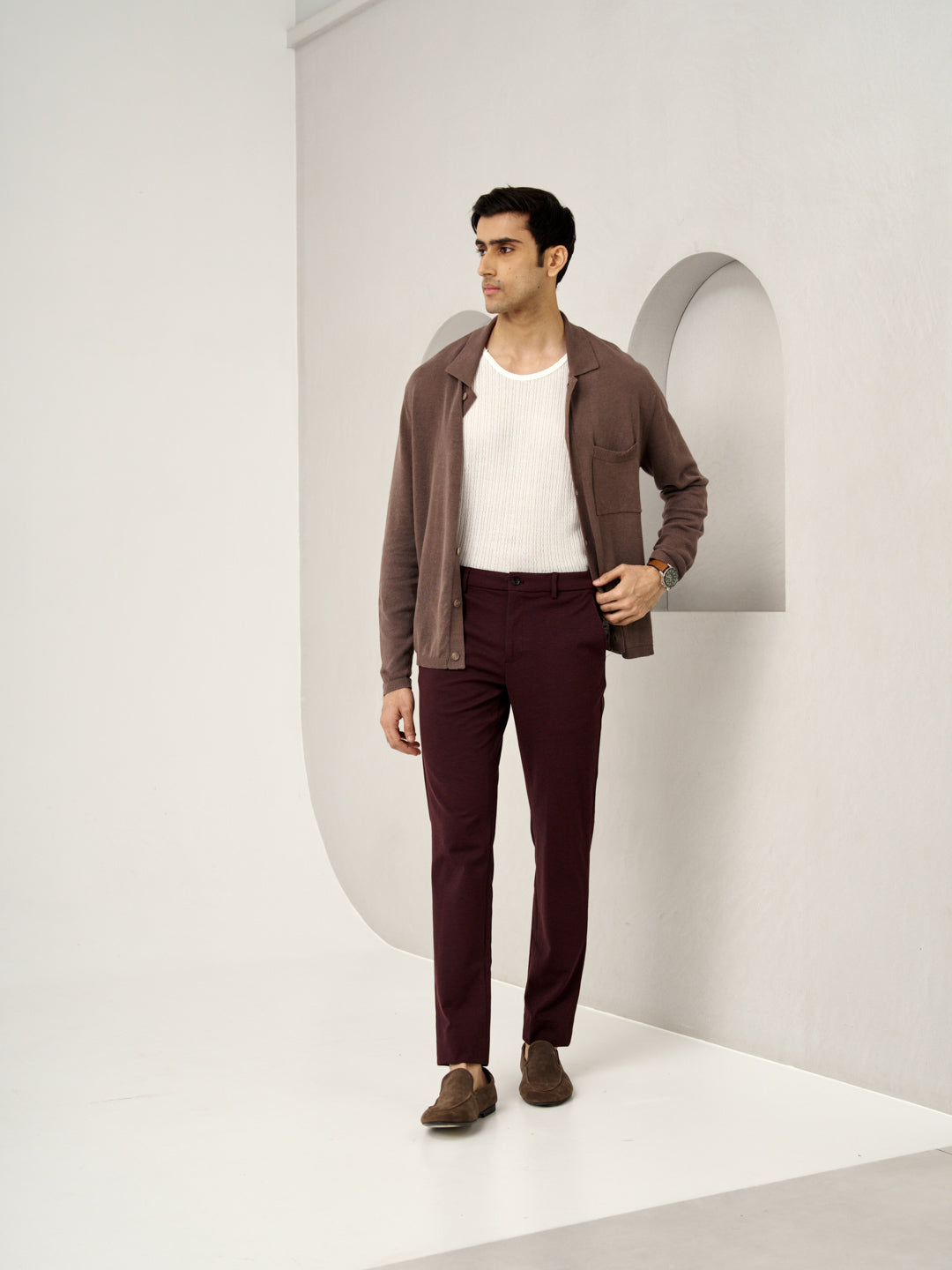 model standing in a casual look wearing plum wine trousers by the Pant Project
