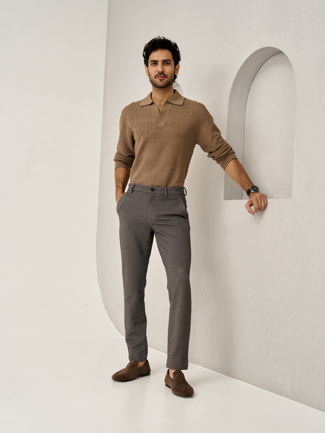 model wearing granite texture custom pants from the Pant Project with a brown knit sweater