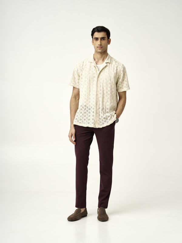 model wearing plum wine pants from the Pant Project paired with a cream knitted shirt